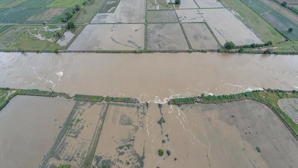 Floodwater standing across a low floodplain, seen from directly above